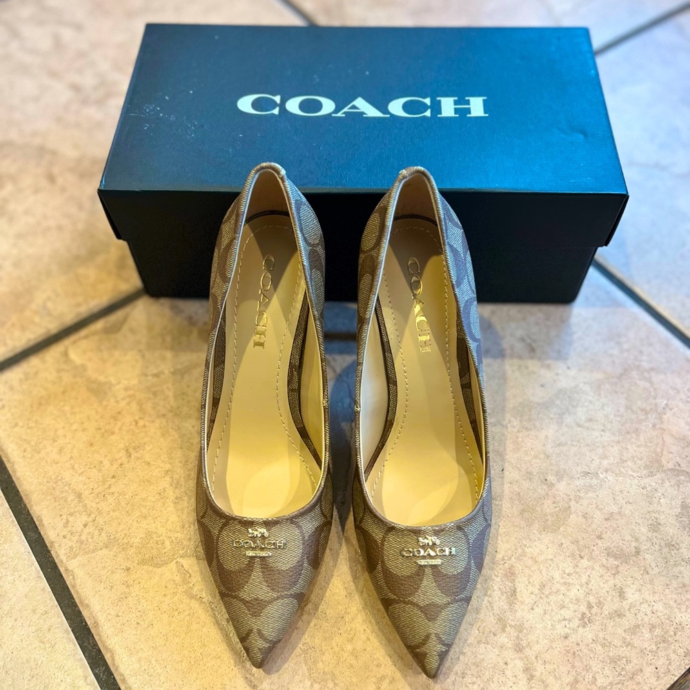 COACH monogrammed pumps. Size 7.5. Bought but never worn.